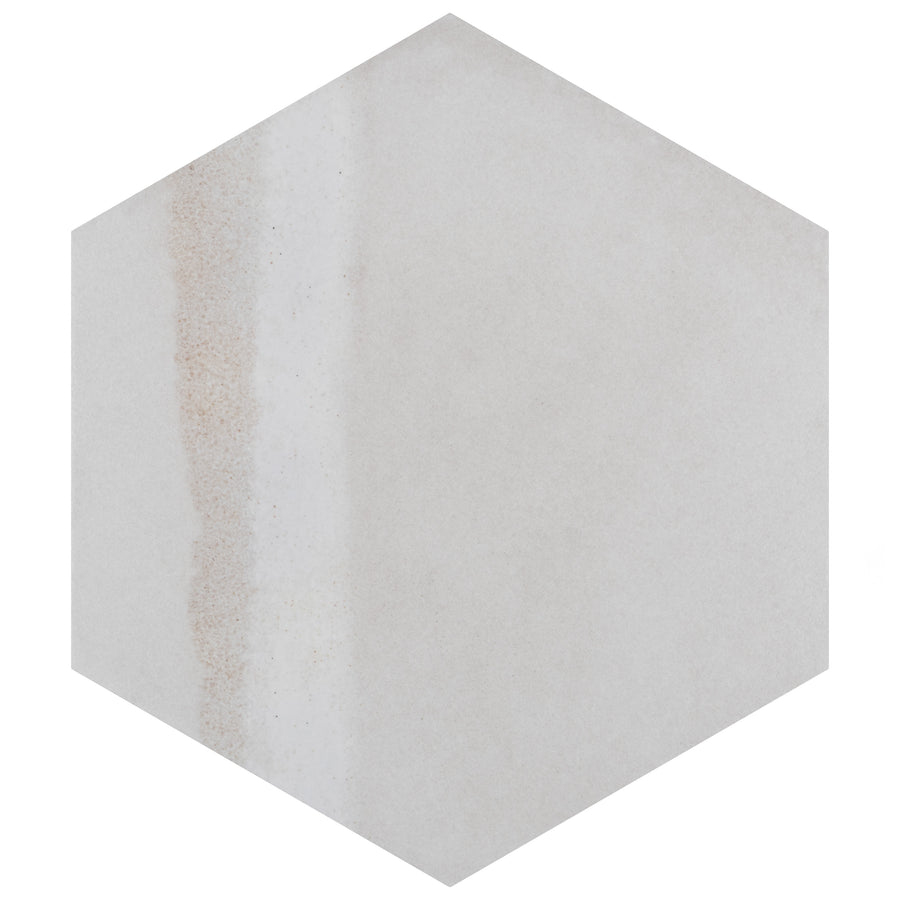 Hexagonal tile with a subtle, uneven vertical stripe in light brown on a mostly off-white background. The design is minimalist and textured, giving a natural, stone-like appearance.