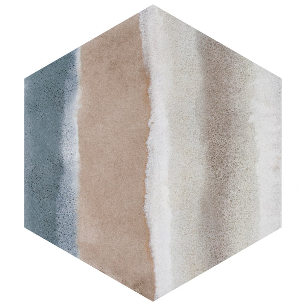 A hexagonal tile with vertical stripes in blue-gray, tan, white, and light gray, resembling a watercolor or sandy beach pattern.