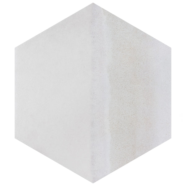 A three-dimensional hexagonal shape with a light, textured surface; the left side is smooth and white, while the right side has a slightly rougher, off-white appearance.