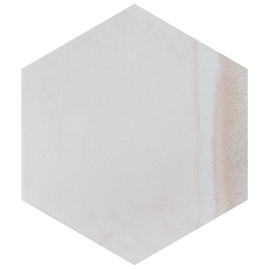 A hexagonal tile with a smooth, light beige surface and a subtle gradient of sandy brown tones along one edge.