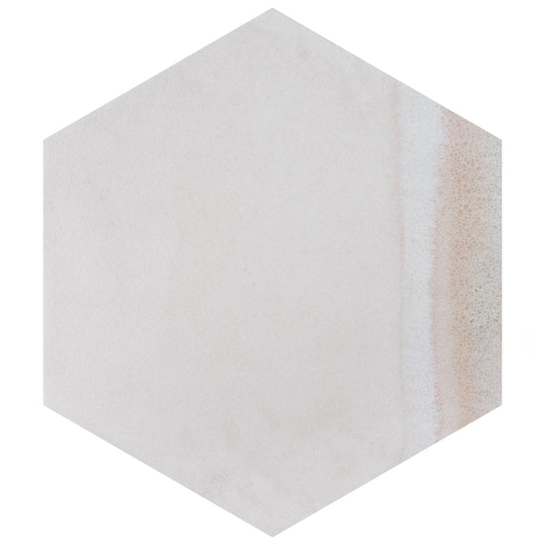 A hexagonal tile with a smooth, light beige surface and a subtle gradient of sandy brown tones along one edge.