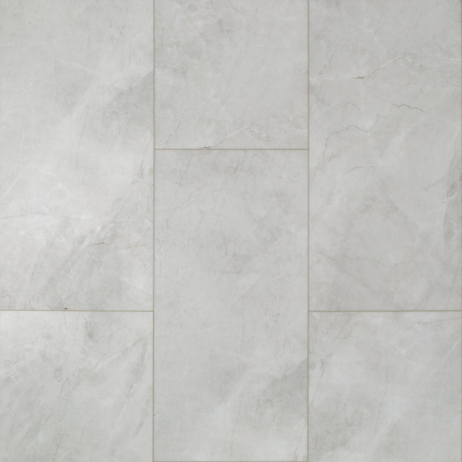 Coretec CT Plus Tile Luxury Vinyl Tile features light gray marble tones with subtle white veining in a staggered pattern, delivering a smooth, elegant stone look ideal for luxury vinyl and resilient flooring applications.