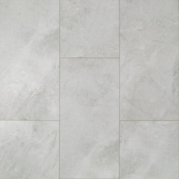 Coretec CT Plus Tile Luxury Vinyl Tile features light gray marble tones with subtle white veining in a staggered pattern, delivering a smooth, elegant stone look ideal for luxury vinyl and resilient flooring applications.