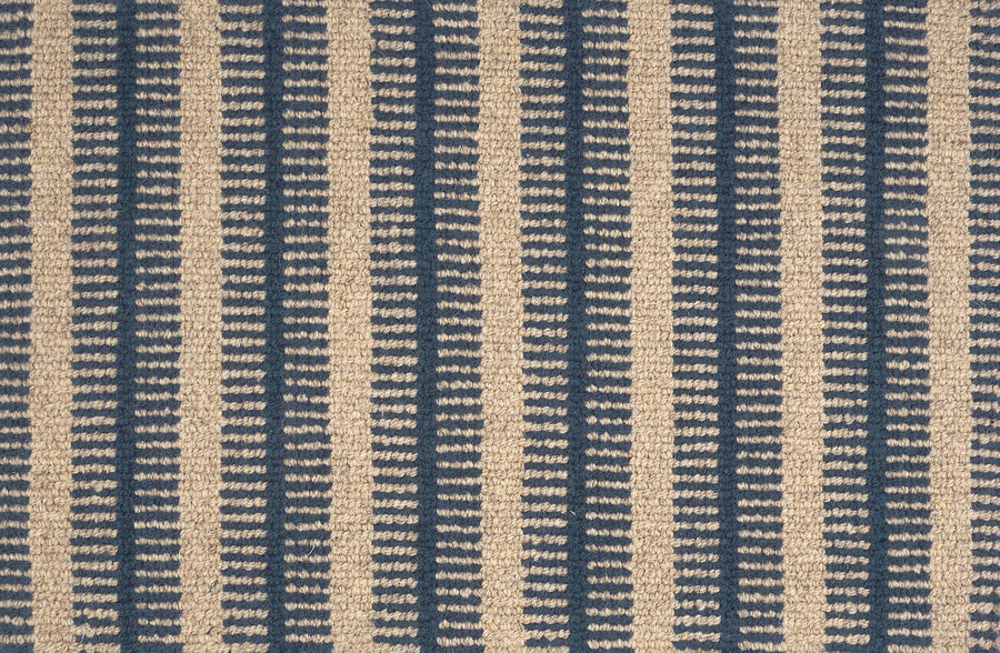 Close-up of the Feng Shui On Trend Carpet, showcasing a repeating pattern of vertical beige and blue stripes with small horizontal beige stitches—ideal for luxurious, trendy home decor.