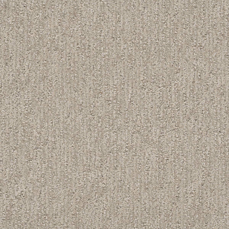 A close-up of Finishing Touch Berber Carpet in Cosmo, featuring a subtle textured pattern and soft looped fibers—perfect for high-traffic areas.