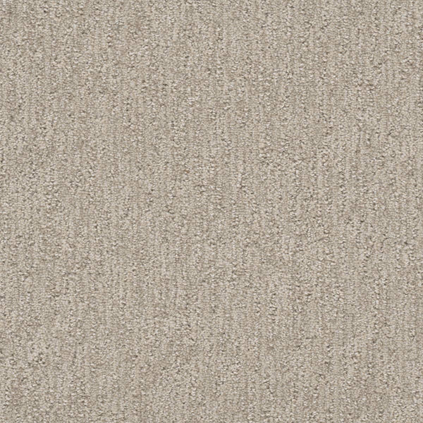 A close-up of Finishing Touch Berber Carpet in Cosmo, featuring a subtle textured pattern and soft looped fibers—perfect for high-traffic areas.