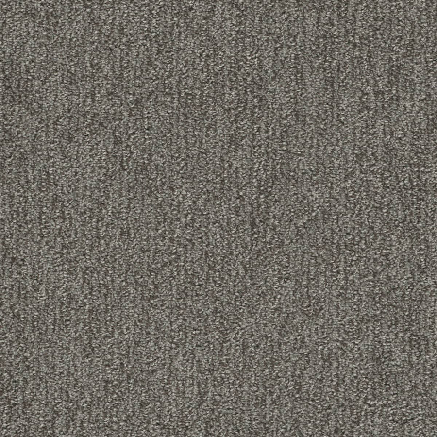Close-up of Finishing Touch Berber Carpet in Deep color, featuring tightly woven textured fibers for a uniform, slightly speckled look—perfect for high-traffic areas.
