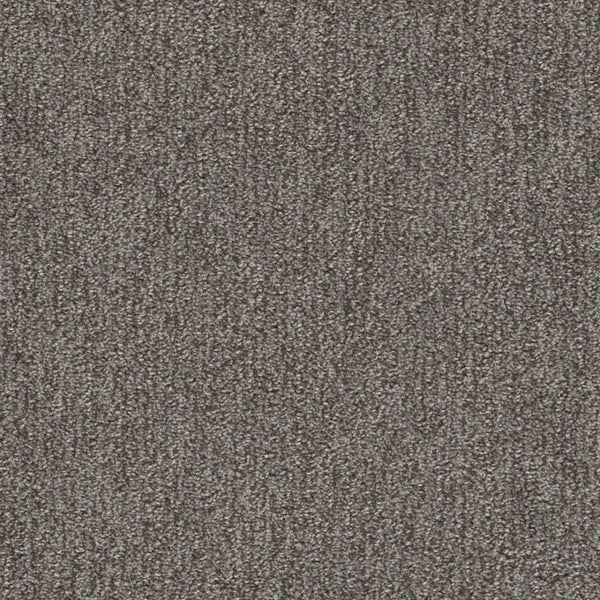 Close-up of Finishing Touch Berber Carpet in Deep color, featuring tightly woven textured fibers for a uniform, slightly speckled look—perfect for high-traffic areas.