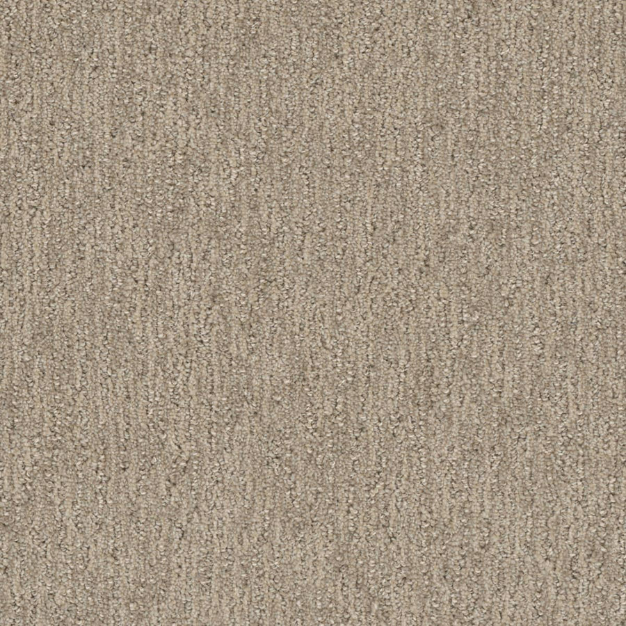 Close-up of the Finishing Touch Berber Carpet in Dulce, featuring soft, looped fibers and a subtle vertical pattern—its durable construction makes it perfect for high-traffic areas.