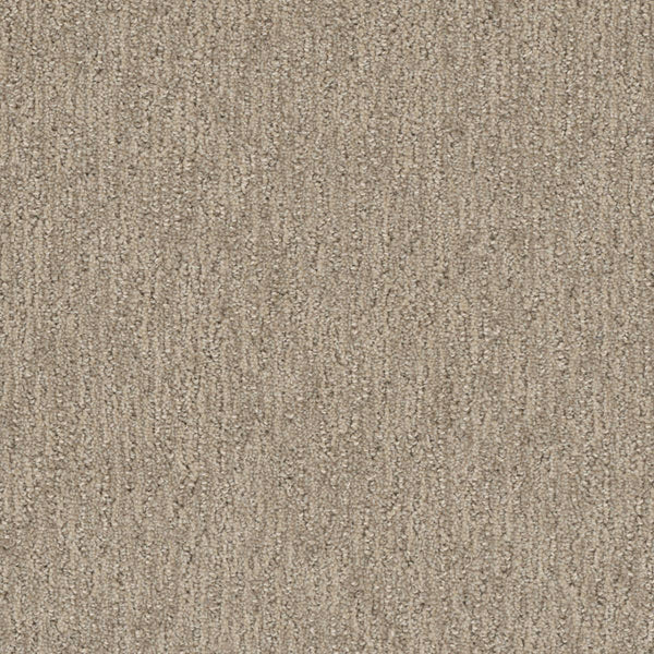 Close-up of the Finishing Touch Berber Carpet in Dulce, featuring soft, looped fibers and a subtle vertical pattern—its durable construction makes it perfect for high-traffic areas.