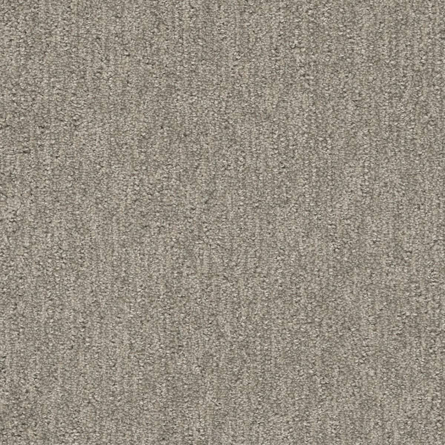 Close-up of Finishing Touch Berber Carpet in greige, featuring a textured surface and subtle linear pattern—its durable construction makes it perfect for high-traffic areas while maintaining a soft, uniform look.