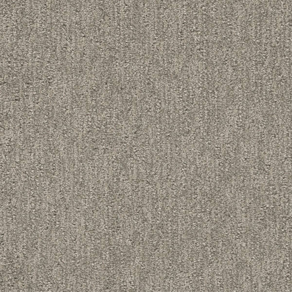 Close-up of Finishing Touch Berber Carpet in greige, featuring a textured surface and subtle linear pattern—its durable construction makes it perfect for high-traffic areas while maintaining a soft, uniform look.