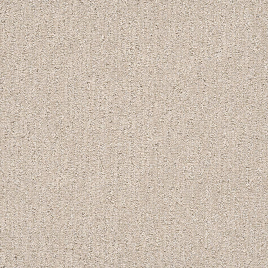Close-up of the Finishing Touch Berber Carpet in Macaroon—featuring soft, looped fibers and a subtle, uniform pattern. Its durable construction makes it perfect for high-traffic areas.
