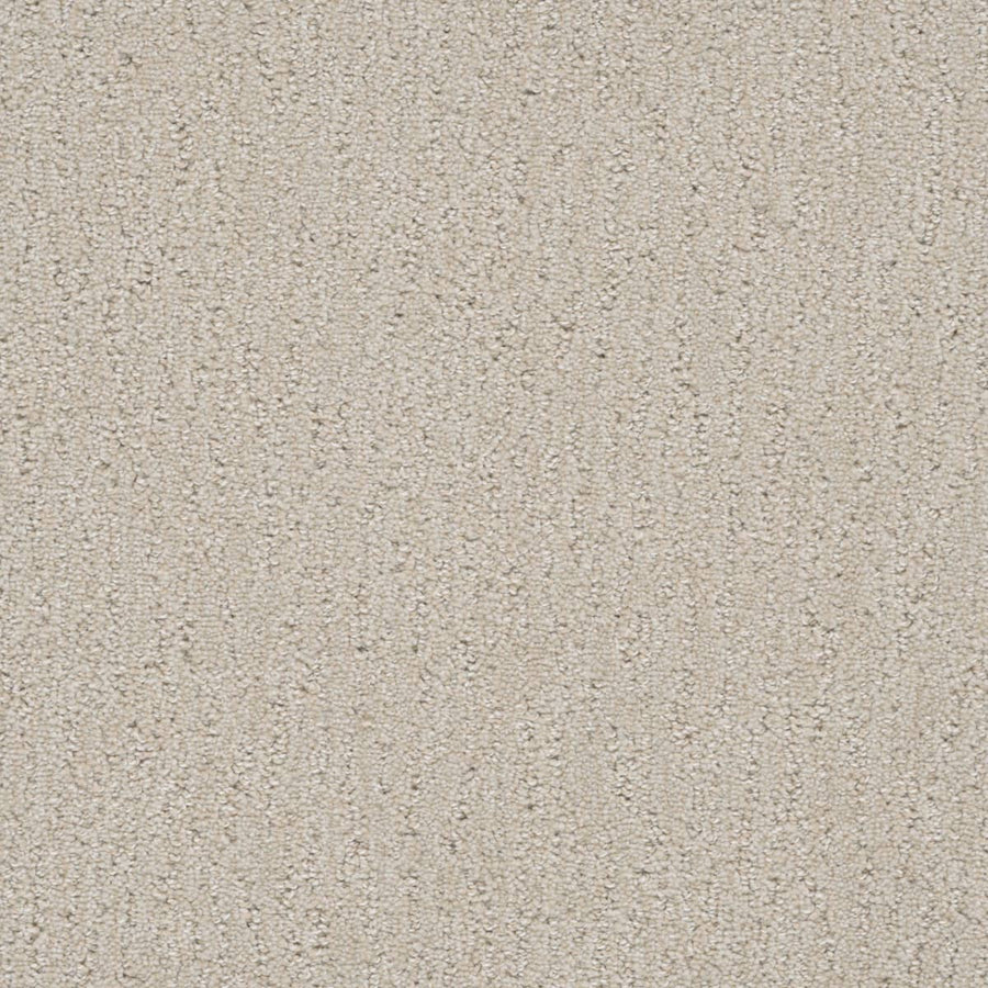 Close-up of Finishing Touch Berber Carpet in Pearl color, featuring a textured loop pattern. Durable fibers offer a soft, uniform look with subtle shading—perfect for high-traffic areas.