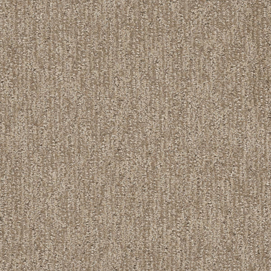Close-up of Finishing Touch Berber Carpet in Shortbread, featuring a textured, looped pile and subtle linear pattern. The soft, even surface is perfect for high-traffic areas in homes or offices.