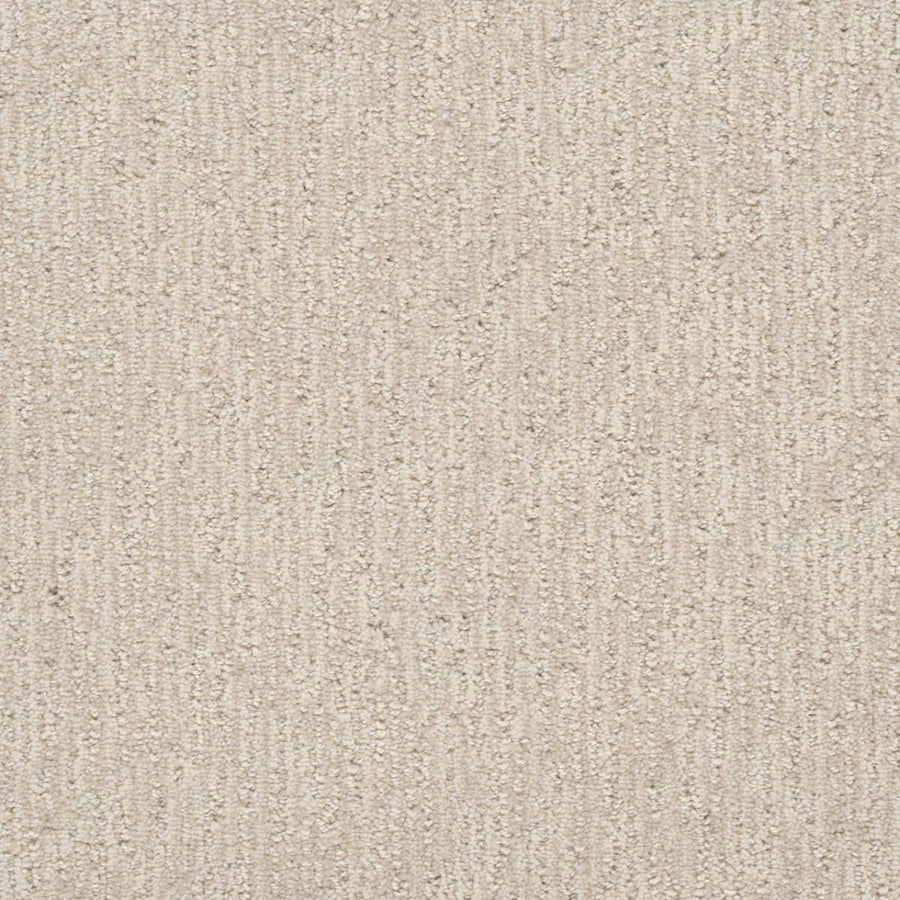 Close-up of the Finishing Touch Berber Carpet in Snow, featuring a soft, neutral beige color and subtle textured vertical lines, making it ideal for high-traffic areas.