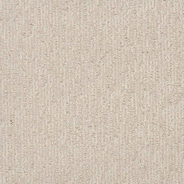 Close-up of the Finishing Touch Berber Carpet in Snow, featuring a soft, neutral beige color and subtle textured vertical lines, making it ideal for high-traffic areas.
