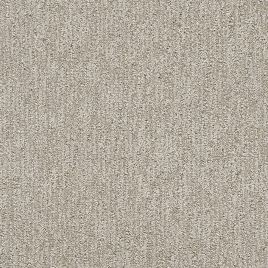 Close-up of Finishing Touch Berber Carpet in Vintage—a soft, dense, and uniform light beige carpet with a subtle vertical linear pattern, ideal for high-traffic residential or commercial flooring.