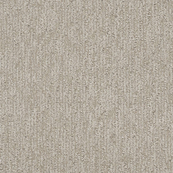 Close-up of Finishing Touch Berber Carpet in Vintage—a soft, dense, and uniform light beige carpet with a subtle vertical linear pattern, ideal for high-traffic residential or commercial flooring.