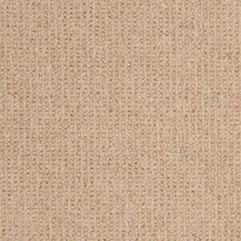 Close-up of Dublin Berber Carpet in Flanagan color, featuring a soft, textured pattern of evenly spaced stitches. The cozy surface is reminiscent of knitted fabric, making it ideal for premium flooring in your home.