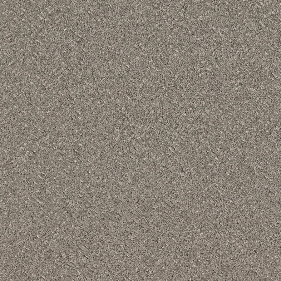 Close-up of Favoured Path Pet Friendly in Flannel shows a textured gray surface with a subtle diagonal zigzag pattern—reminiscent of concrete, it's ideal for durable flooring in contemporary spaces and modern commercial applications.