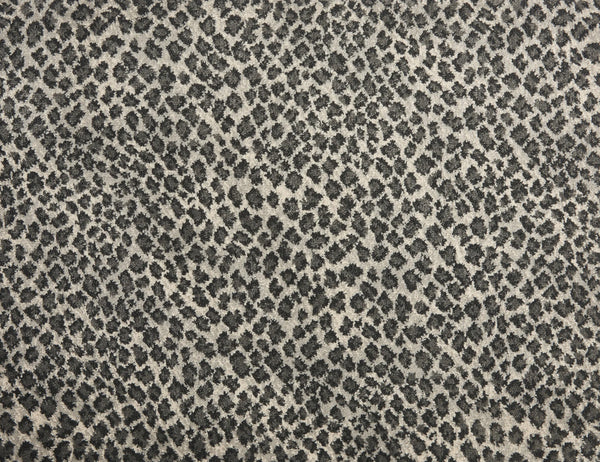 Close-up of Serengeti On Trend Carpet in Flannel, showcasing a black and gray leopard print with irregular dark spots on a light background—perfect for adding contemporary style and the look of animal fur to quality flooring.