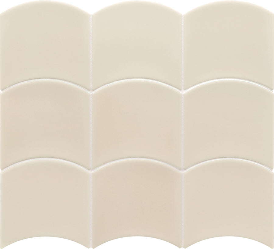 The Flow Motion 5x5 Glazed Ceramic Tile is a premium, cream-colored tile with a unique scalloped top edge, creating a repeating wave pattern when arranged in a grid.