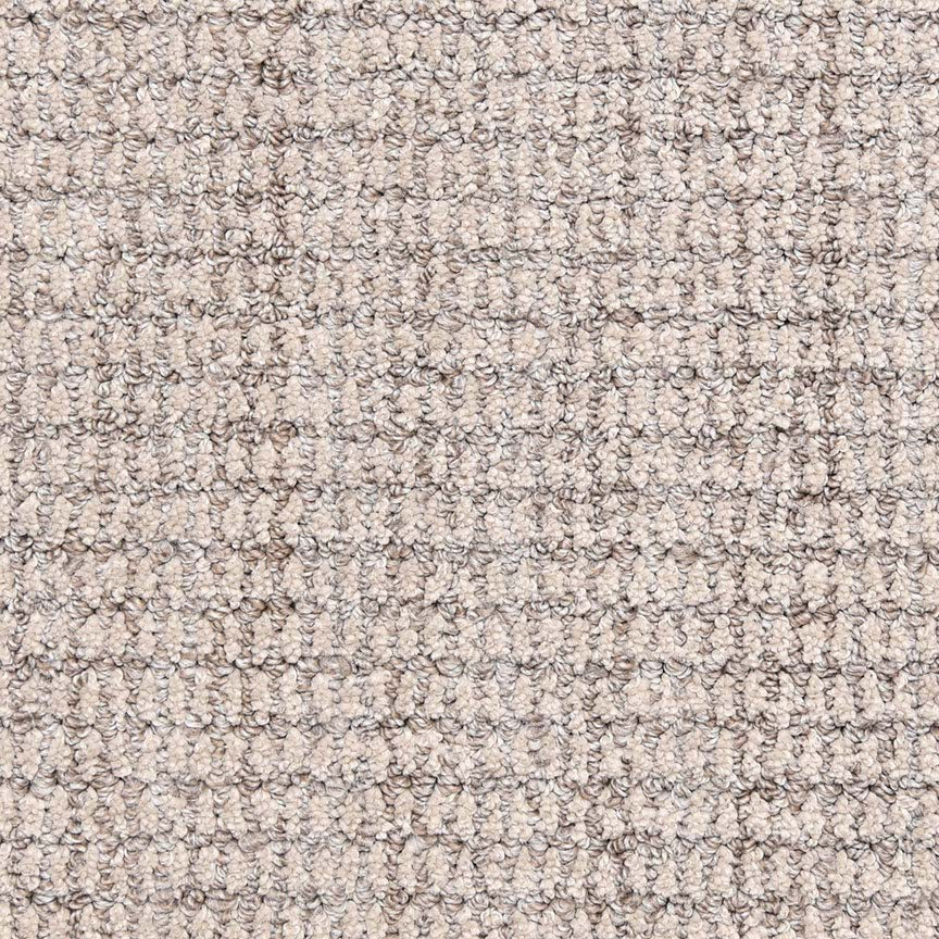 Close-up of Aspen Berber Carpet in Fog color featuring a soft, uniform surface with tightly woven looped pile for a durable, grid-like textured finish.