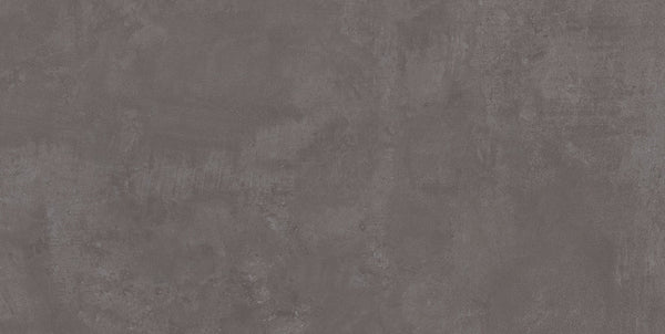 The Forge 24x48 Rectified Porcelain Tile features a textured dark gray finish with subtle color variations, delivering a sleek, contemporary look that mimics the appeal of concrete.