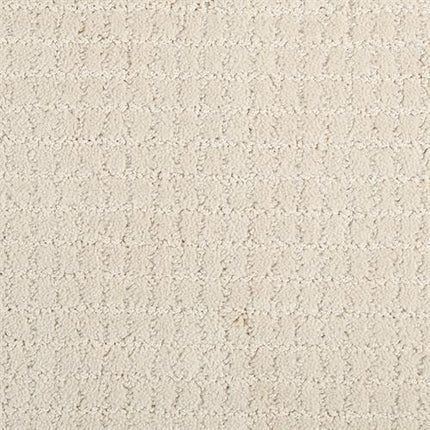 Close-up of Yucatan Pet Friendly Carpet in Fresh color—a light beige, textured, durable carpet featuring a subtle, repeating pattern of small raised shapes for a soft, cozy look.