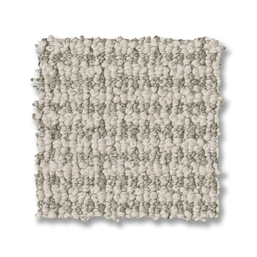 A square Laine On Trend Carpet swatch features a textured loop pattern with alternating light beige and grayish-tan stripes, displayed elegantly on a white background.