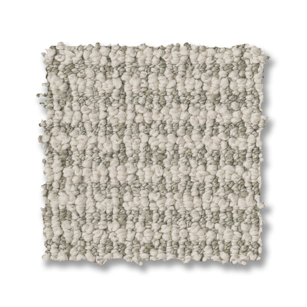 A square Laine On Trend Carpet swatch features a textured loop pattern with alternating light beige and grayish-tan stripes, displayed elegantly on a white background.