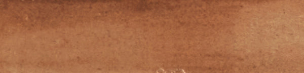 A close-up of the Galaxy 2x10 Porcelain Tile reveals a textured, reddish-brown surface with subtle color variations, perfect for luxurious and elegant porcelain tile installations.