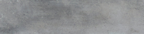 A close-up view of the Galaxy 2x10 Porcelain Tile reveals a gray, glazed surface with a slightly rough texture and subtle shading, creating an elegant, luxurious tile look.