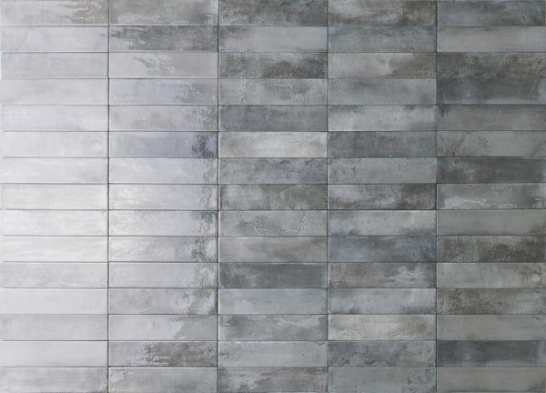 Rectangular gray tiles arranged in a horizontal grid pattern, with a slightly reflective surface and various shades of gray creating a textured, modern look.