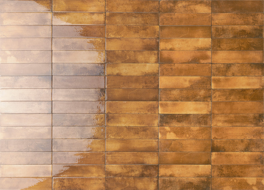 Rectangular brown tiles arranged in a horizontal grid; the left side of the tiles appears glossy and reflective, while the right side is matte and rougher in texture.