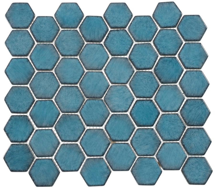 The Greenwich 2" Hexagon Glass Mosaic Tile in Lafayette Blue features a grid of textured hexagonal tiles with visible grout lines, adding a unique geometric and contemporary touch to any space.