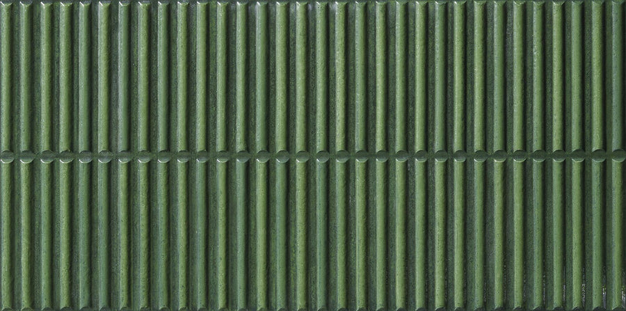 Dunes 12x24 Porcelain Tile features vertical green ribbed textures in two horizontal rows, forming a symmetrical pattern. Its glossy surface reflects light, highlighting the grooves—perfect for backsplashes and feature walls.
