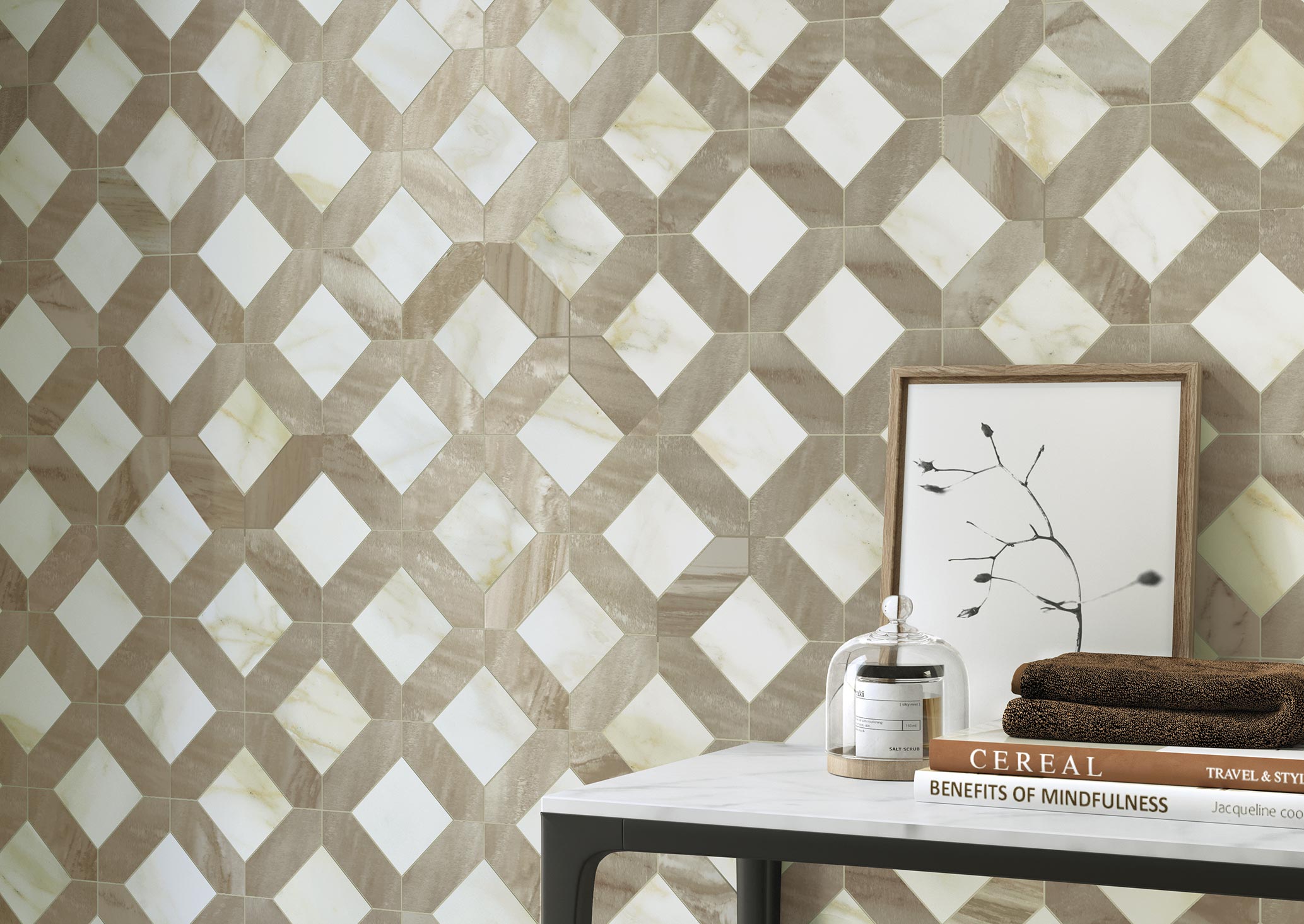
		                            	Wall of Palazzo Lux Mosaic Tile in a diamond pattern of beige, cream, and brown, with a table in the foreground holding books and a candle.
		                            