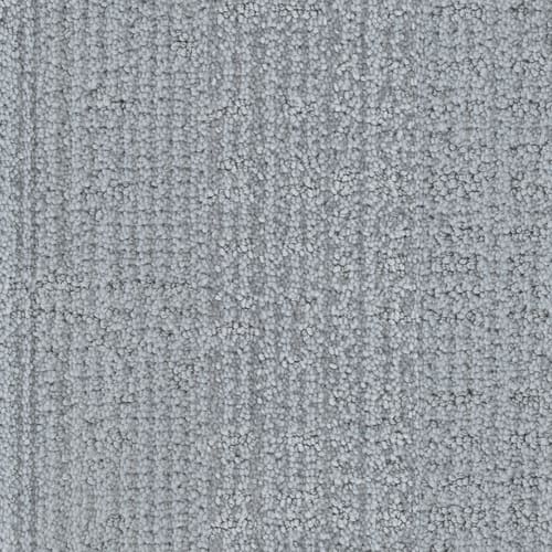 Close-up of Occasion On Trend Carpet in Gala, featuring a light gray hue with a subtle linear pattern, blending small loops and dense fibers for a modern style.