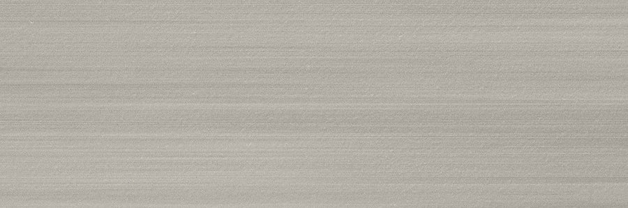A close-up of Met 4x12 Porcelain Tile shows a smooth, light gray surface with fine horizontal lines, offering a brushed-metal look—an ideal choice for contemporary spaces seeking modern design trends.