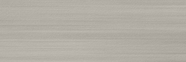 A close-up of Met 4x12 Porcelain Tile shows a smooth, light gray surface with fine horizontal lines, offering a brushed-metal look—an ideal choice for contemporary spaces seeking modern design trends.