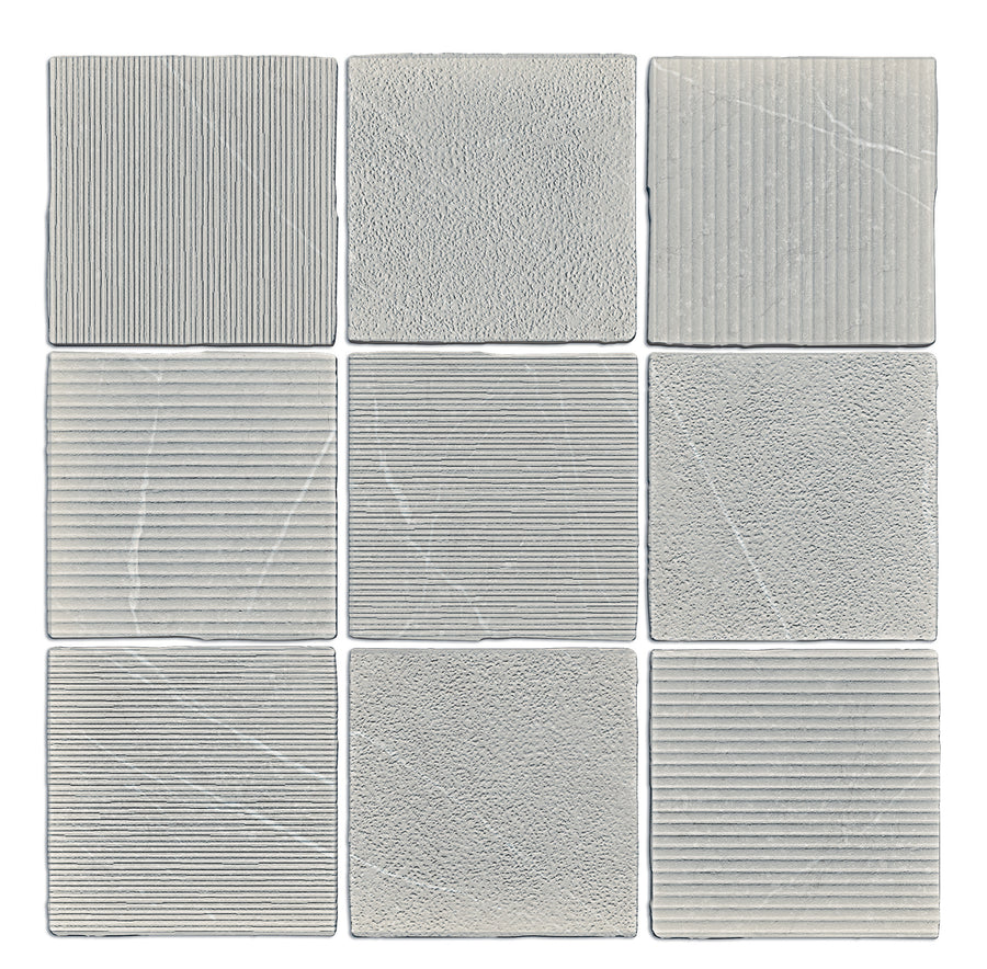 Nine Gea Hand Carved 4.7" x 4.7" gray ceramic tiles arranged in a 3x3 grid, each showcasing unique textured details—fine lines and grainy surfaces—expertly crafted and displayed on a white background.