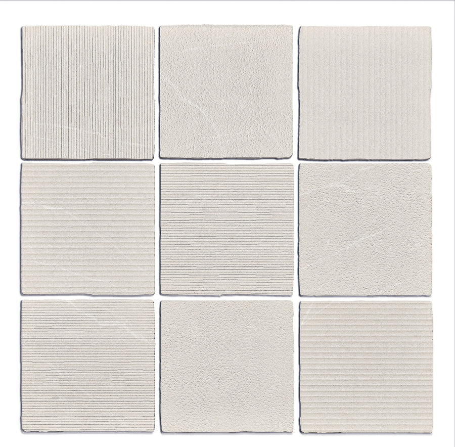 Nine Gea Hand Carved 4.7" x 4.7" Ceramic Tiles in Linen, arranged in a 3x3 grid, each featuring unique artisanal textures or patterns such as lines, grooves, and stippling.