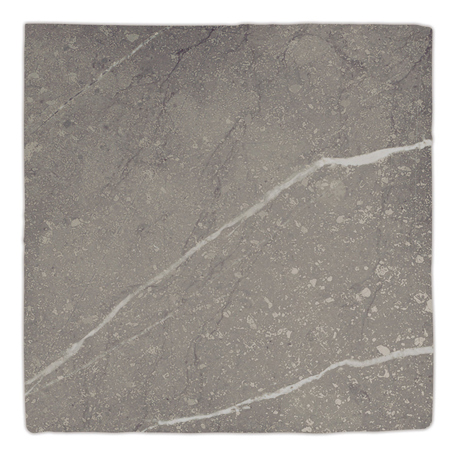 The Gea 4.7" x 4.7" Ceramic Tile in Charcoal features natural veins, speckled patterns, and two bold white diagonal streaks—perfect for modern accent walls or chic tile backsplashes.