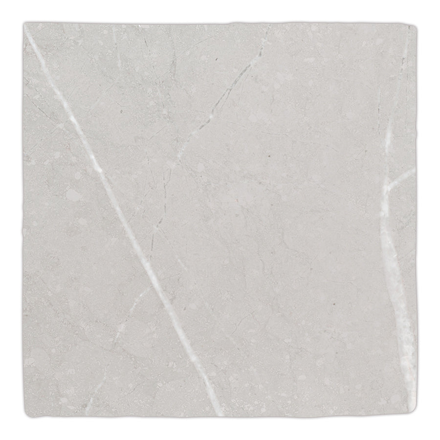 The Gea 4.7" x 4.7" Ceramic Tile in gray features subtle white veining and uneven edges, making it ideal for creating modern accent walls or elegant backsplashes.