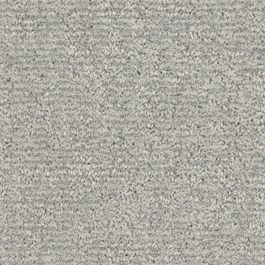 Close-up of Balance Family Friendly Carpet in Gentle—a light gray, textured, stain-resistant carpet with a soft, slightly uneven surface and tightly woven fibers, ideal for family homes.