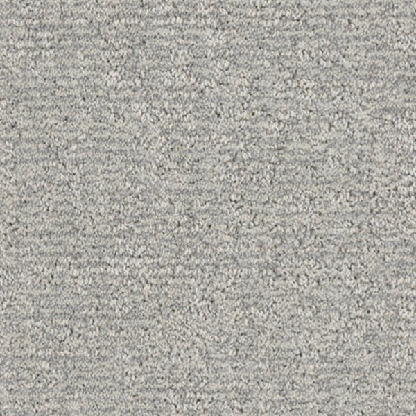 Close-up of Balance Family Friendly Carpet in Gentle—a light gray, textured, stain-resistant carpet with a soft, slightly uneven surface and tightly woven fibers, ideal for family homes.