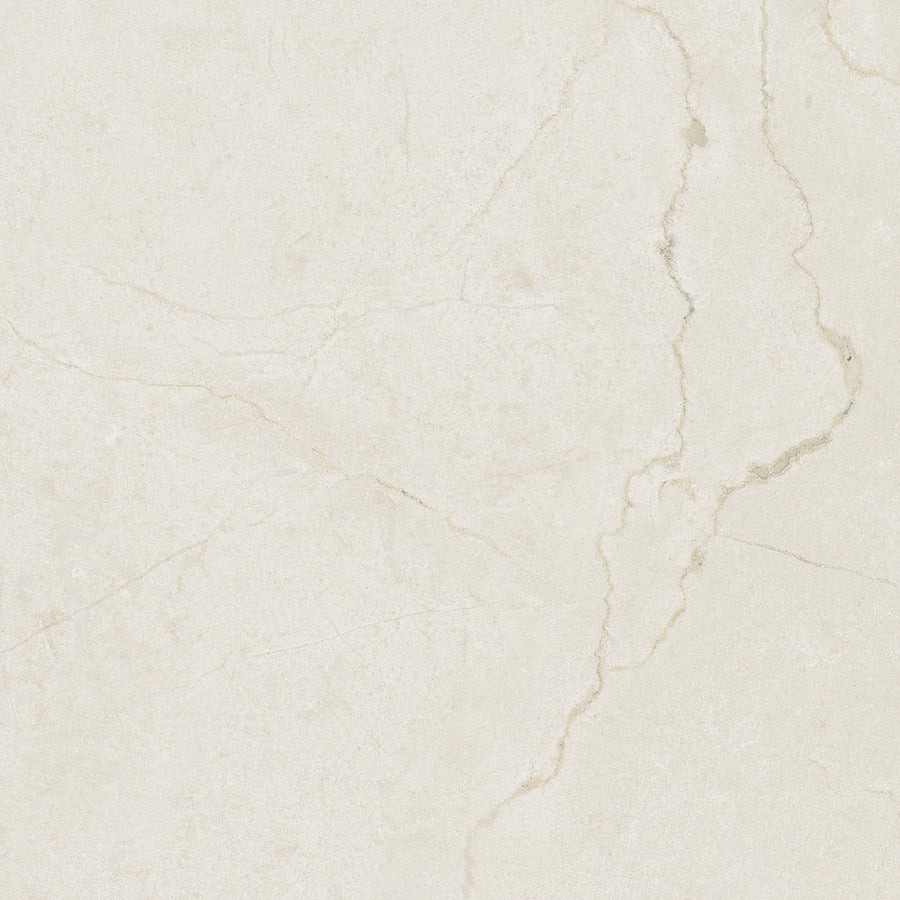 A close-up of Glam Marfil 12x12 Matte Porcelain Tile shows a light beige marble look with subtle natural veins and cracks, bringing a smooth, elegant touch ideal for modern design.