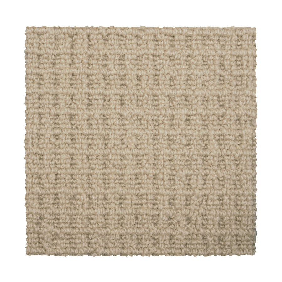 A square swatch of Glen Abbey II Berber Carpet in Thatch, featuring a textured, grid-like looped pattern in light beige against a white background—offering elegant style and comfort for flooring.